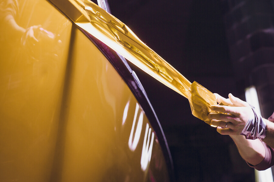 A boat enjoying the finishing touches of the wrapping process.