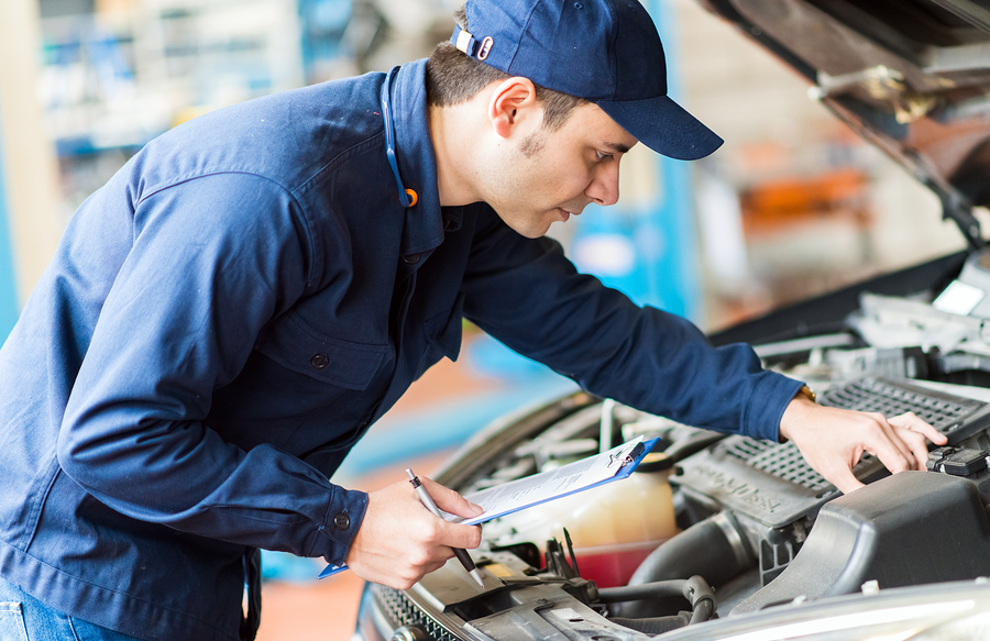 Portrait of a mechanic at work in his garage