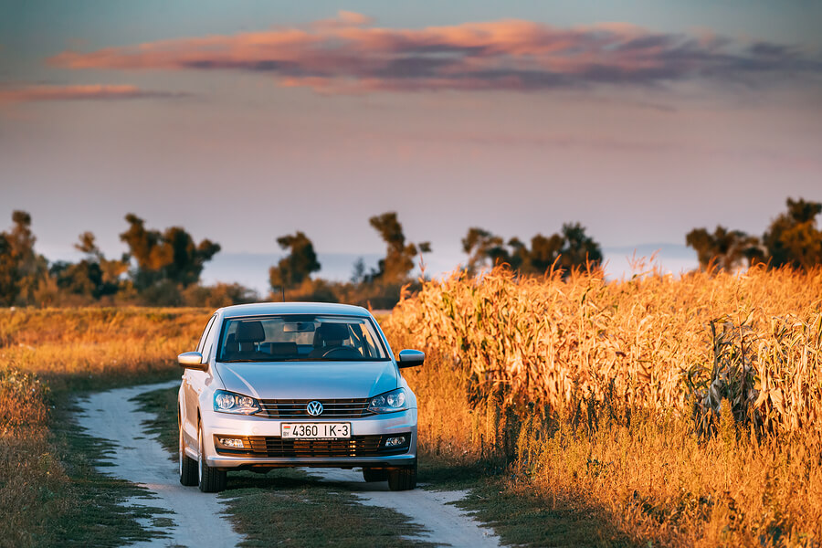 A Volkswagen Polo driving through the countryside.