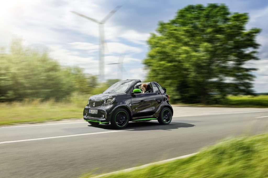 A Smart Electric Drive Cabrio on the sunny streets.